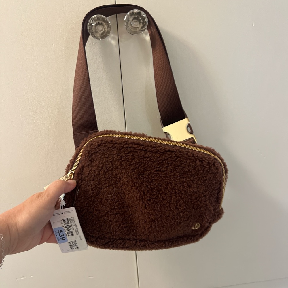 lululemon brown sherpa belt bag with gold hardware